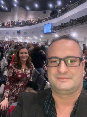 Sharon and Erjon at Church smiling at camera