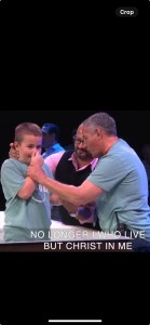 Michael being baptized at the non-denominational church, Erjon watching proudly in the background.