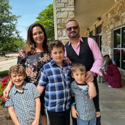 Sharon and family outside church in Sunday clothes